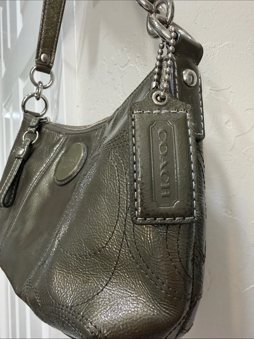 Coach metallic logo subtle